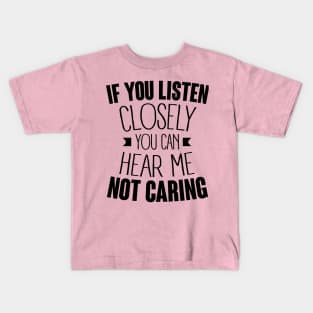 listen closely you can hear me not caring (black) Kids T-Shirt